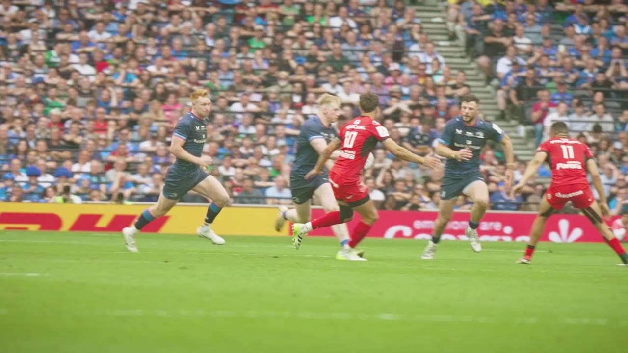 Match action, players breaking through a tackle