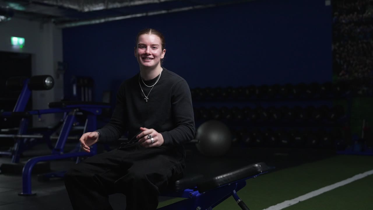 Cinematic portrait of an athlete lit in a gym
